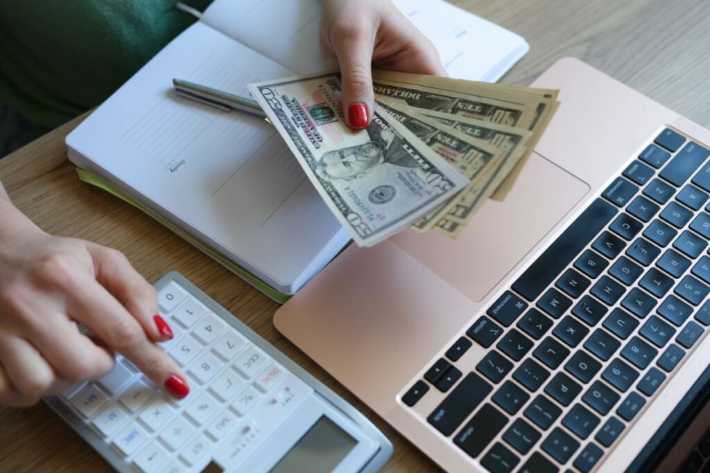 Women-budgeting-using-calculator-and-planner.jpg